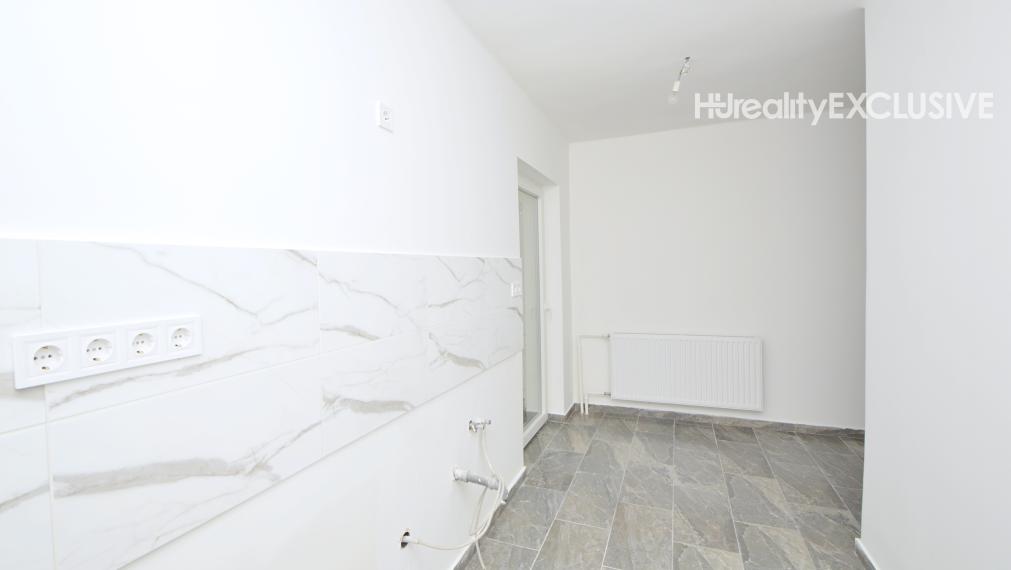 Predaj 3i byt s 260 m2 pozemkom, garážou a pivnicou, Bezenye